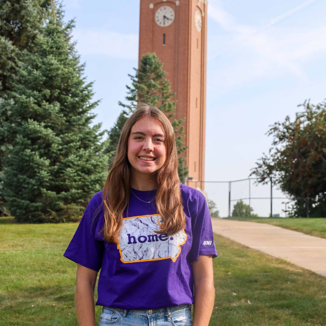 McKenzie standing in front of the Campanile.