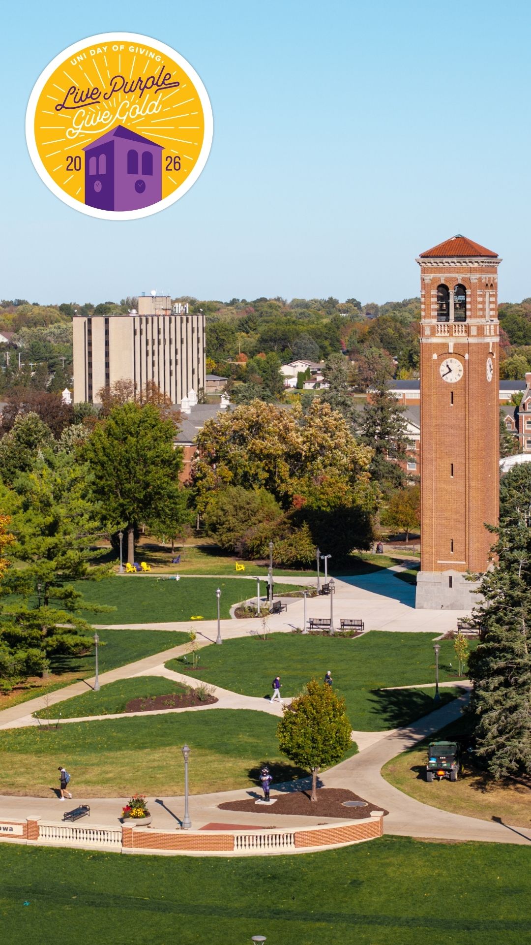 An aerial view of the Campanile with the Live Purple Give Gold Logo in the top left corner.