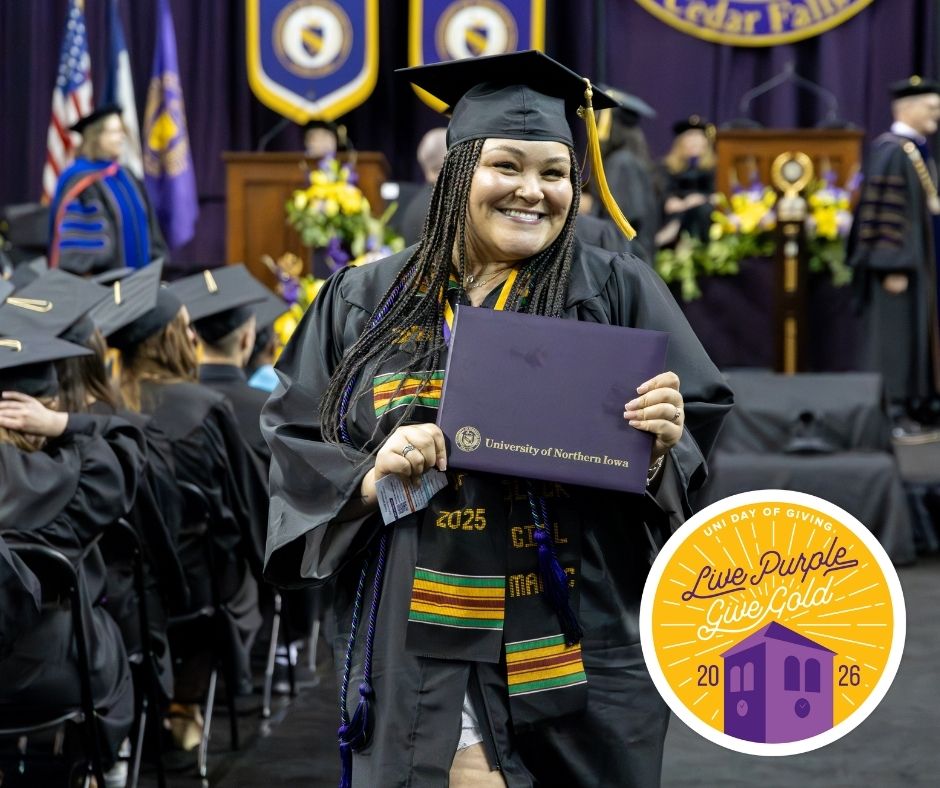 A graduate holding a diploma with the Live Purple Give Gold logo in the bottom right corner.