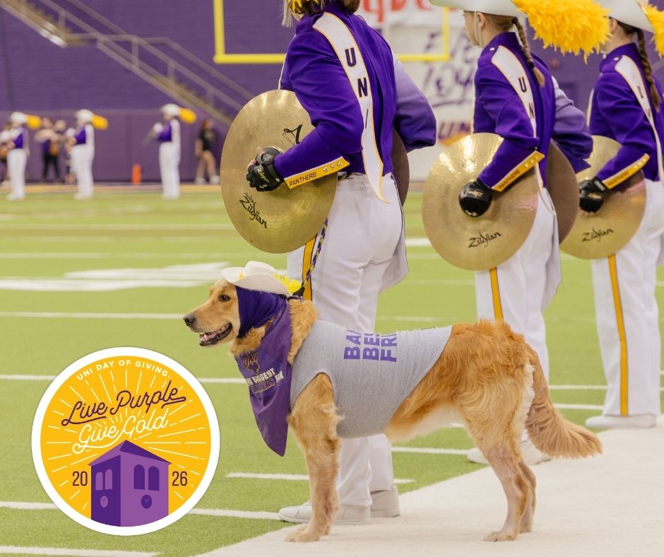 The UNI marching band with a dog and the Live Purple Give Gold logo in the bottom left corner.