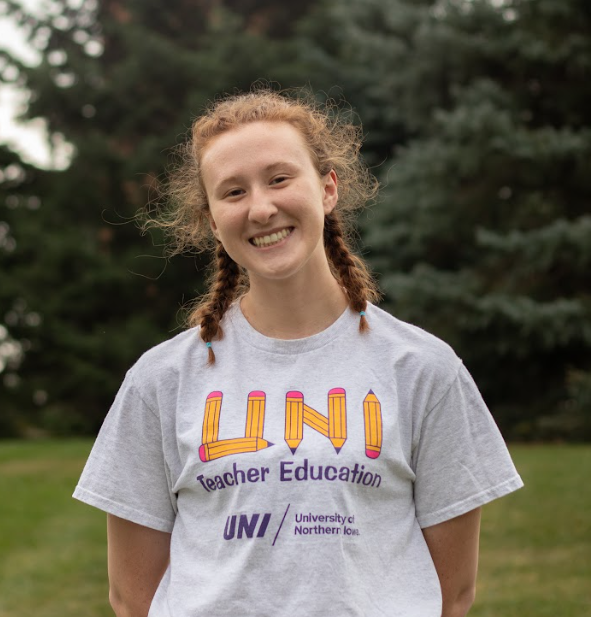 Student smiling with a UNI teacher education shirt on.