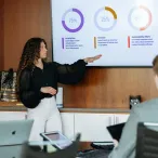 A business student presenting a slideshow.